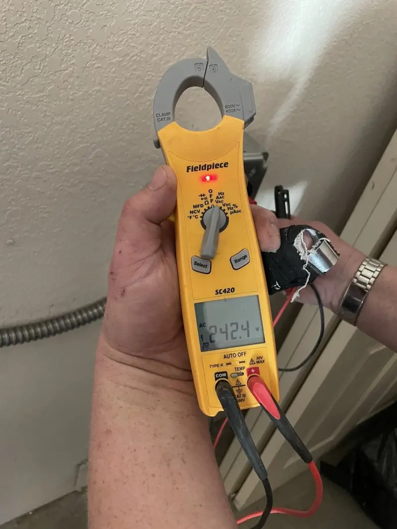 Voltage testing with clamp meter during Electrical Installation Services in Arcadia